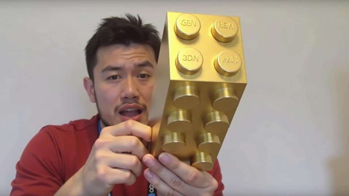 A LEGO employee shows off what he received for his fourth work anniversary: ??a golden LEGO brick we all want now.