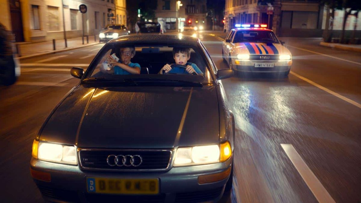 At the wheel of an Audi, a 12‑year‑old boy refuses to stop for police
