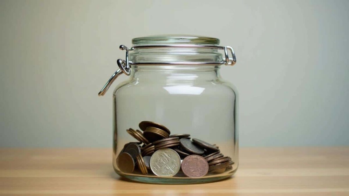 The real world benefit of assigning a specific, unusual container for holding daily loose change as a mental savings trigger